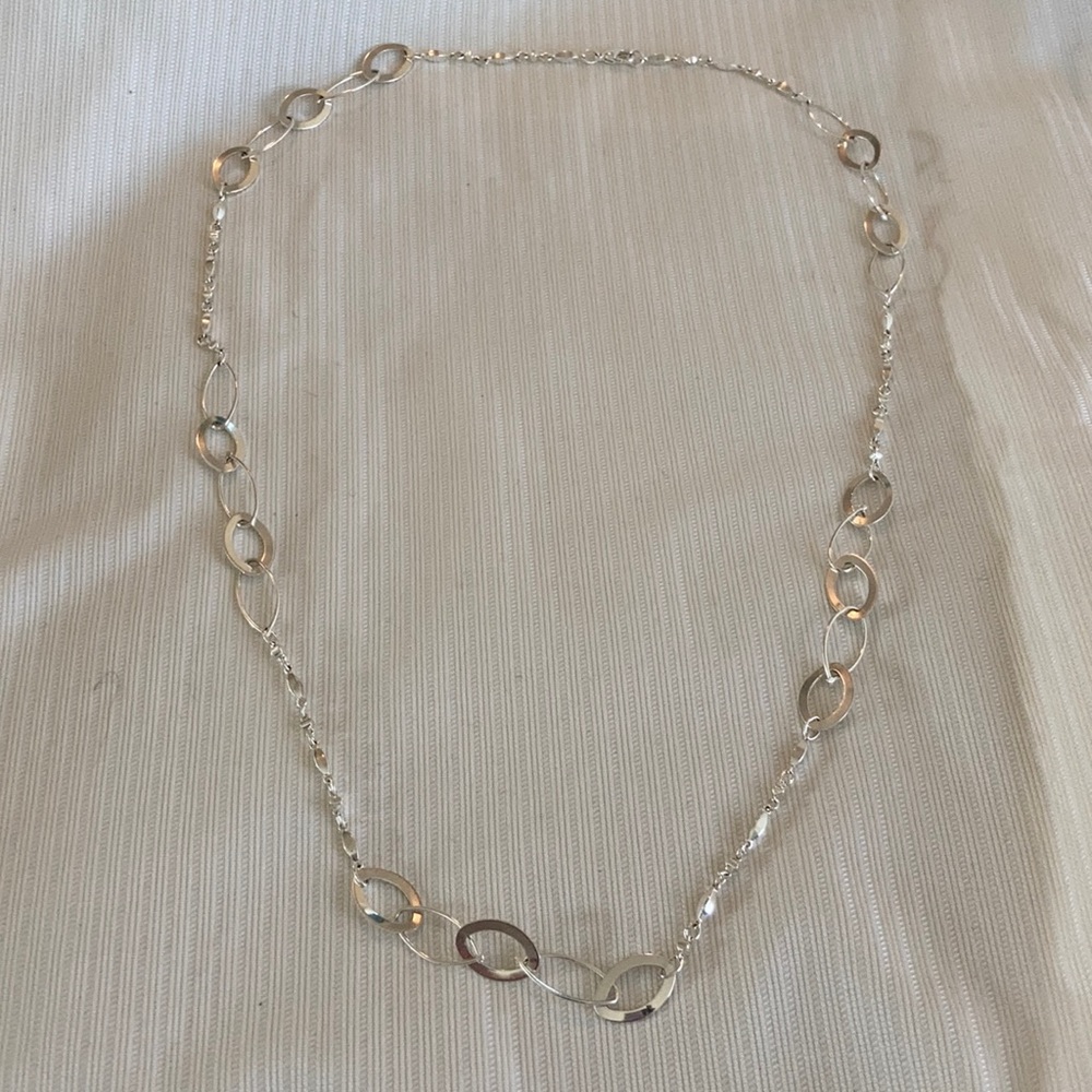 Silver oval connected chain.